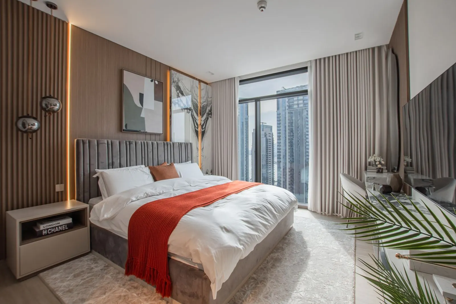 A modern bedroom with a city view, sample image