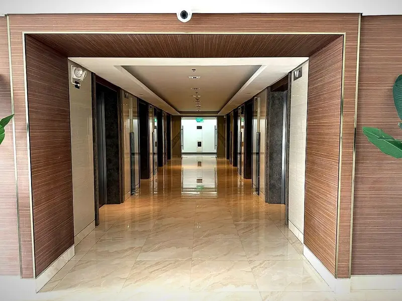 A hallway towards the lifts