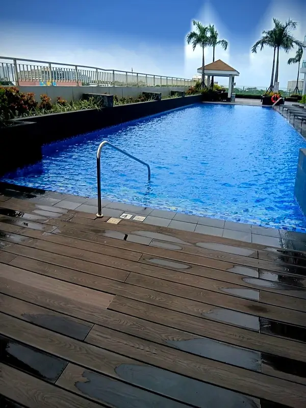 The pool deck with the tower rising above