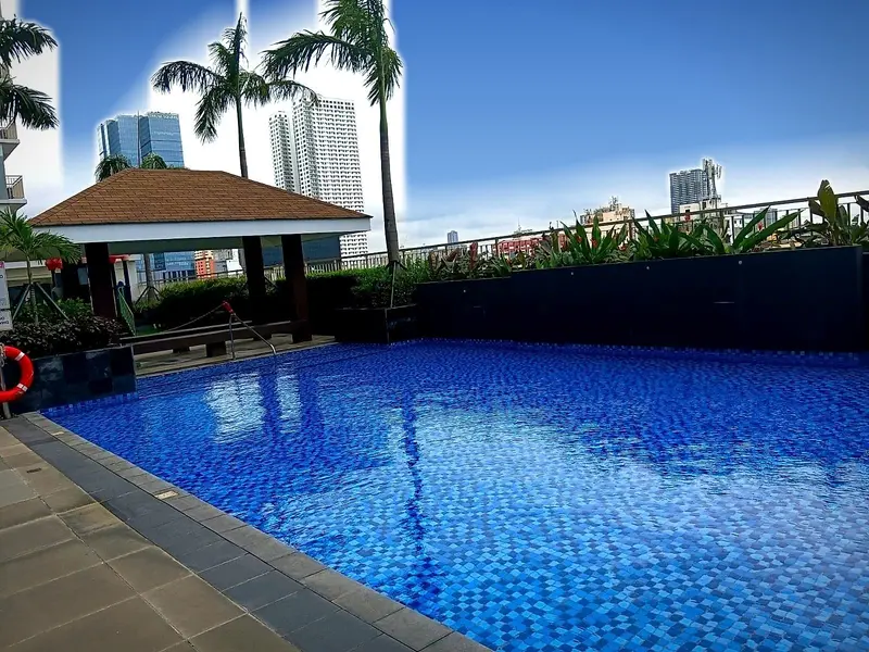 The long pool with cabanas along the side